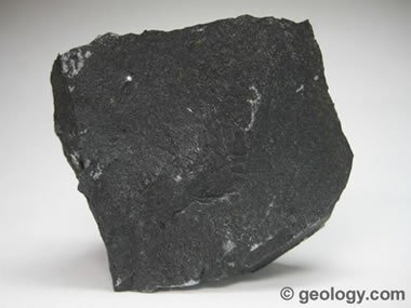 <p>dark-colored, fine-grained, <strong>igneous rock</strong> composed mainly of <strong>plagioclase</strong> and <strong>pyroxene</strong> minerals. It most commonly forms as an extrusive rock. Underlies more of Earth's surface than any other rock type.</p>