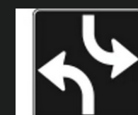 Lane arrows: Two-way left turn lane sign

\

