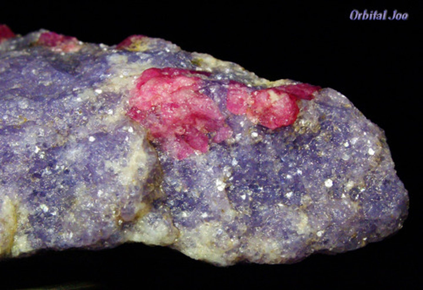 <p>Pink or lilac color, has darker purple dots, type of mica. Vitreous. Flaky.</p>