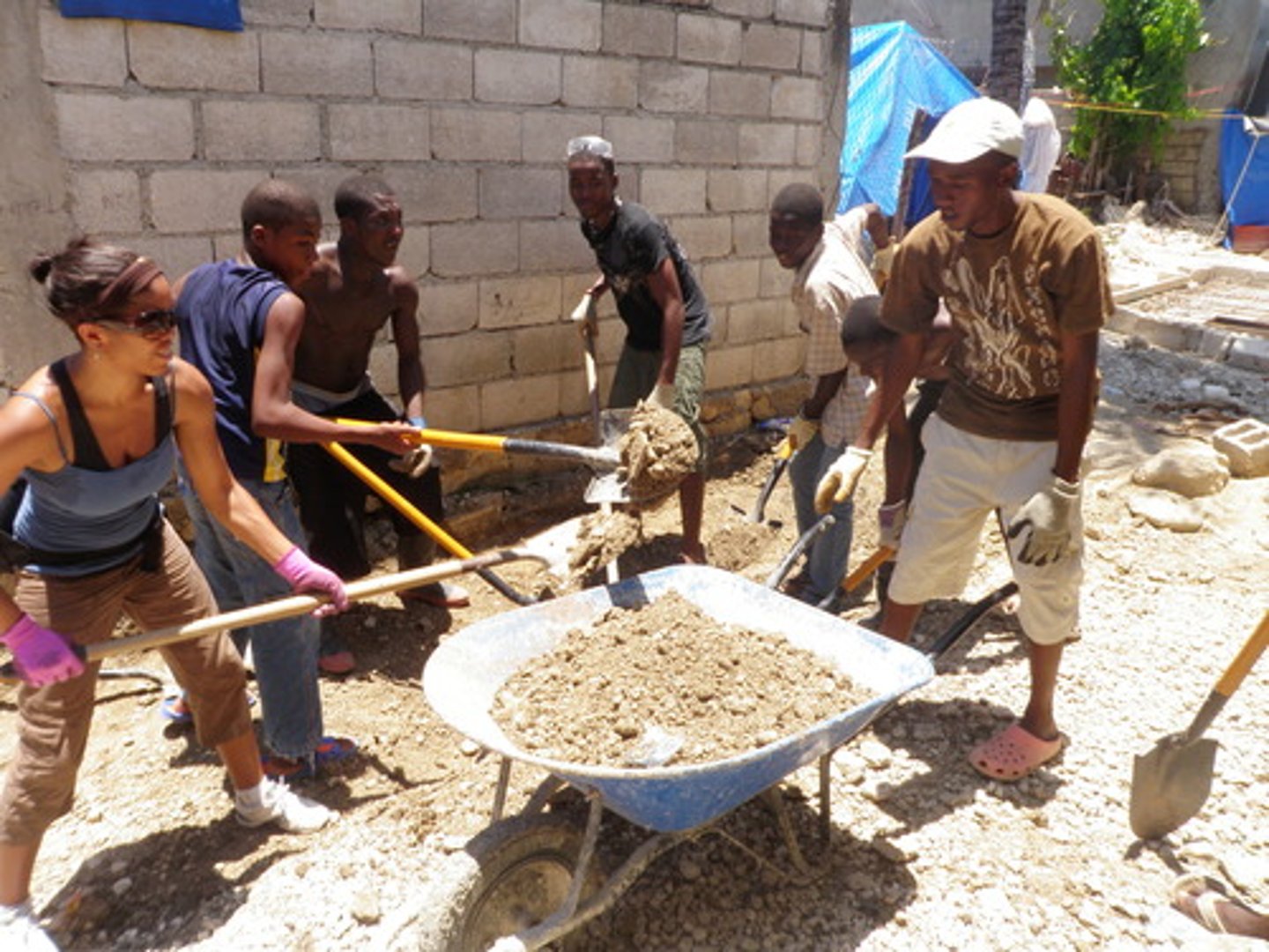 <p>The volunteers helped to build after the disaster.</p>