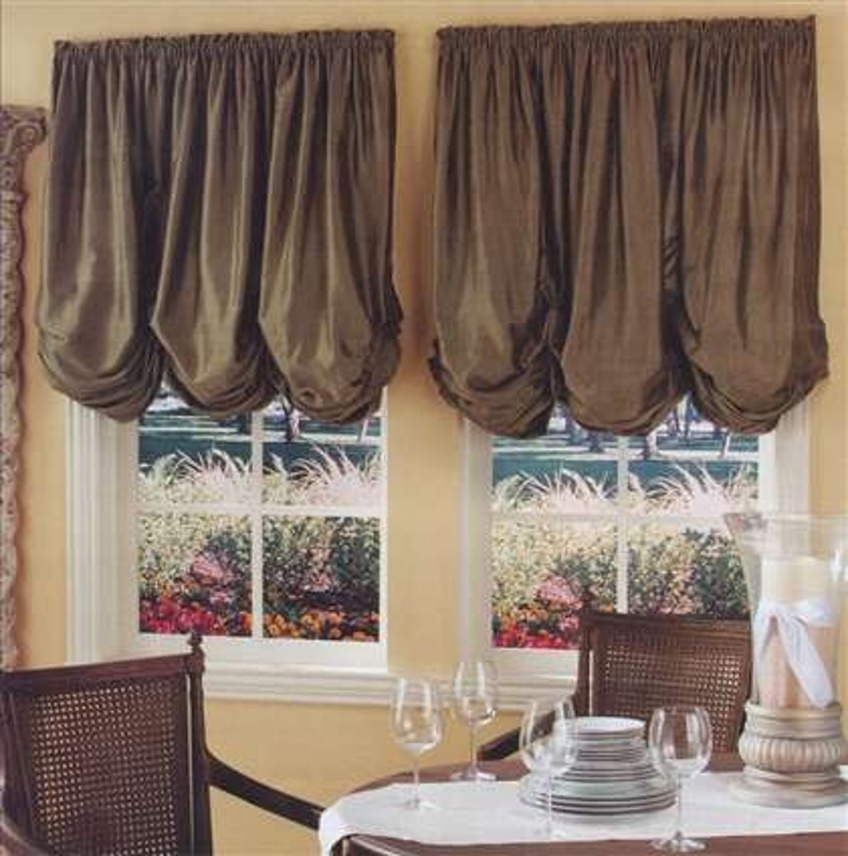 <p>A window treatment with gathered fabric and soft billowy folds.</p>