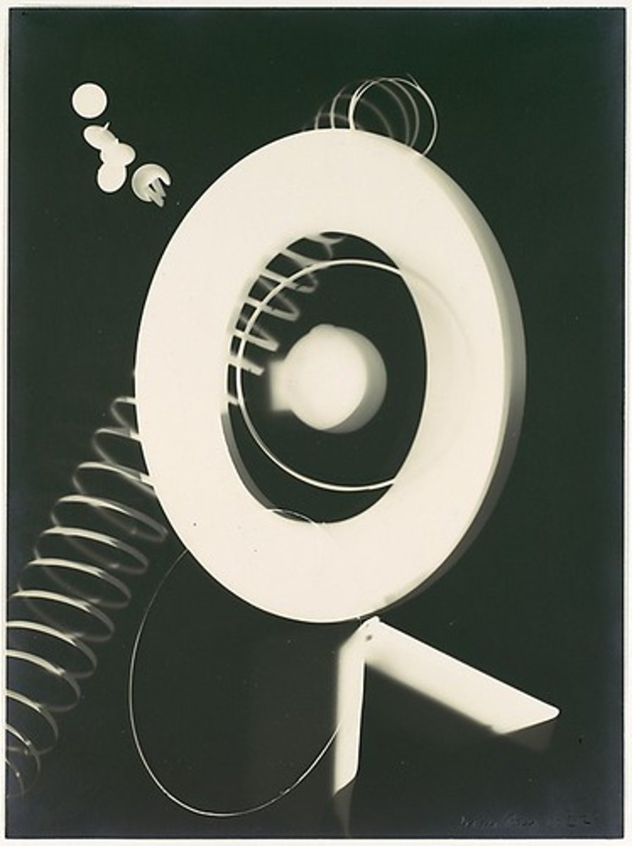 <p>Man Ray, used Surrealism and automatism, briefly exposed film to light (known as solarization), used technique, resulting photographs were known as rayographs, photogram</p>