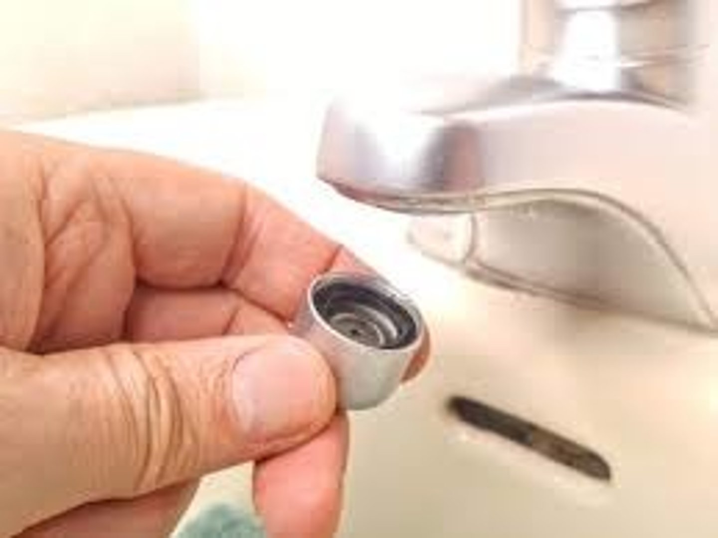 <p>a water flow constrictor attached to the tip of an indoor water faucet to limit the amount of water that flows out of it</p>