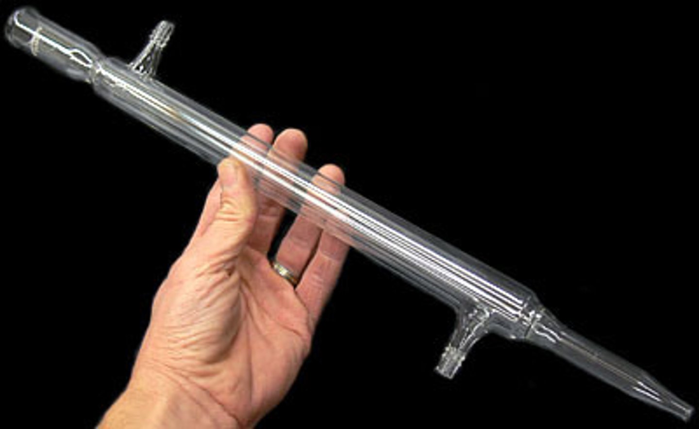 <p>Gases pass through the tube, are cooled by the cold water and condense</p>