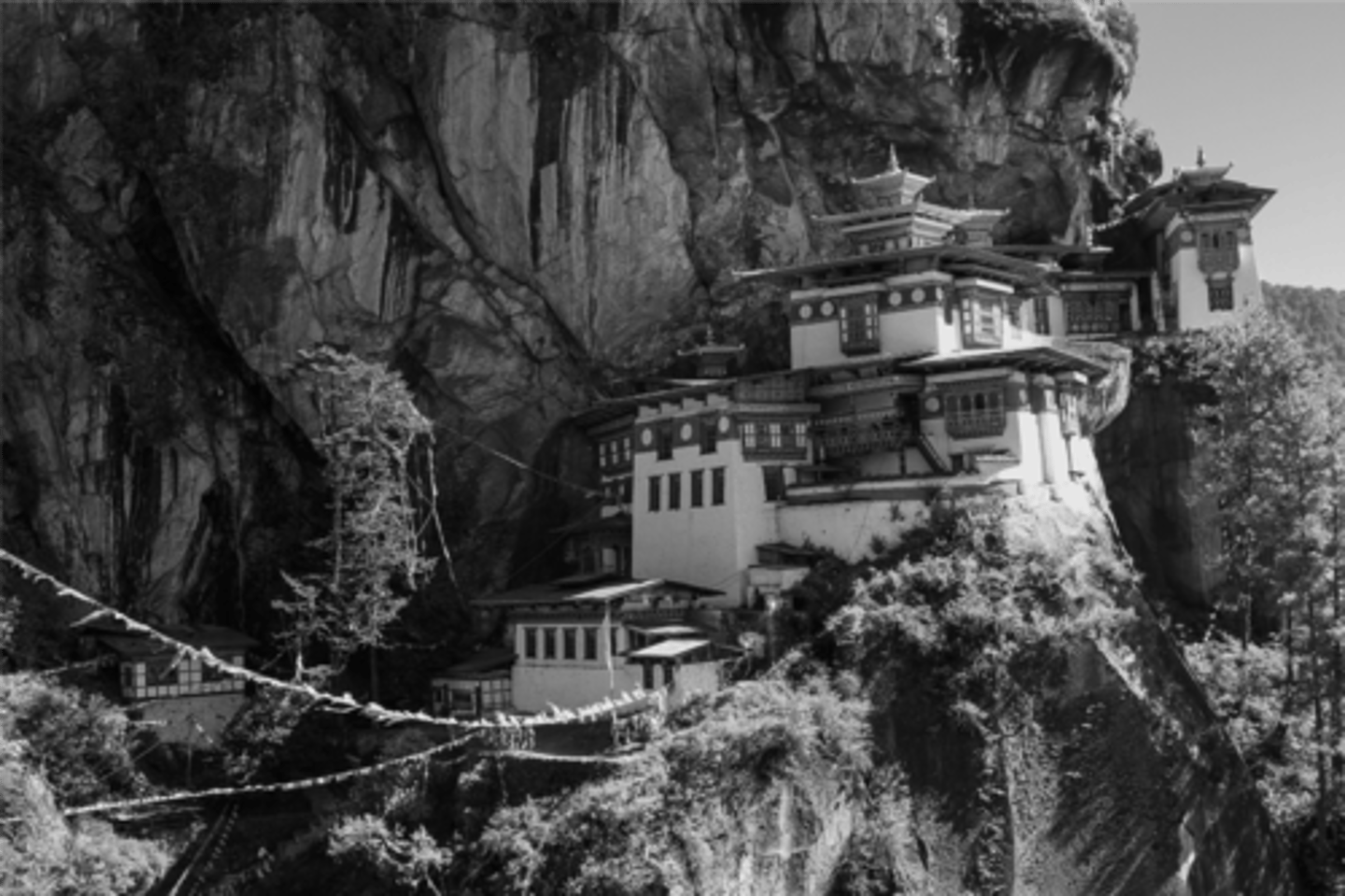 <p>Religion</p><p>Why? The image shows Paro Taktsang, a Buddhist pagoda and monastery in Bhutan. The pagoda is a common architectural style within Buddhism, traced back to the concept of a stupa, used to enshrine sacred relics.</p>