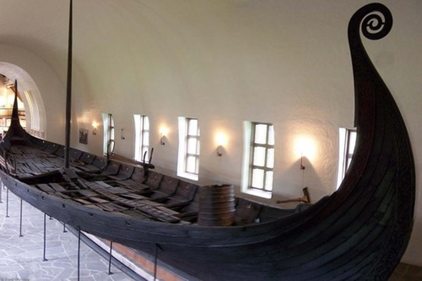<p>Viking; 825 CE</p><p>Possible queen Ase. Two females found. 2 functions= sea vessel and burial</p><p>It was looted. Chests, tapestries, 2 looms.</p><p>Ship mimics sea monster</p><p>Bow and stern have animal interlace/ style and heraldic composition.</p><p>animal interlace on the bow</p>