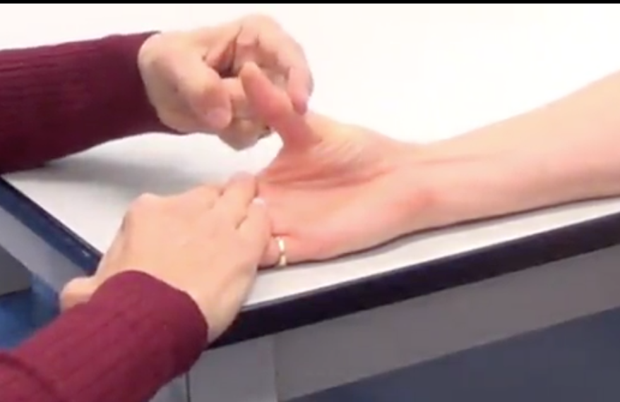 Use one of your fingers on the distal end of the proximal phalanx and try to bring their thumb back towards neutral