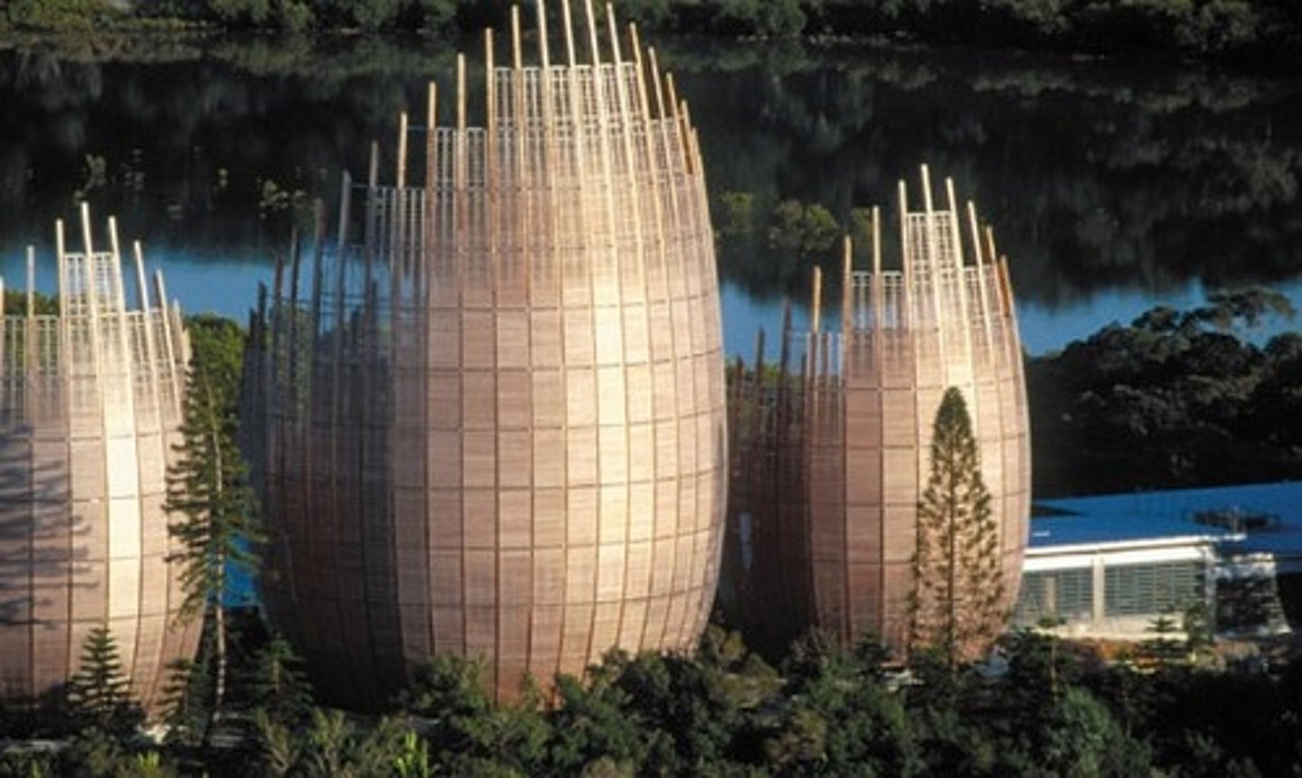 <p>Designed by Renzo Piano in New Caledonia (1998) </p><p>Has two skins: the outer layer is made of iroko wood and the inner layer is made of movable glass louvers.</p><p>Buildings are ventilated passively and act as chimneys to draw warm air out</p>