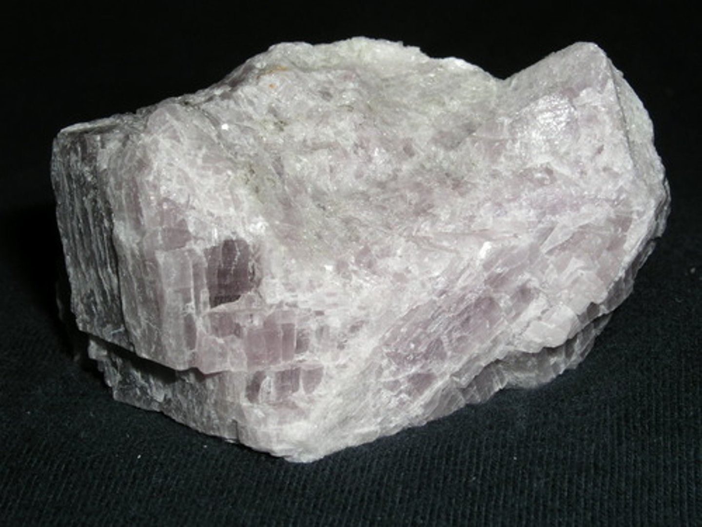 <p>Barite group. <br>Orthorhombic. <br>Massive or in crystalline masses, fibrous, granular, massive.<br>H = 3-3.5<br>SG = 2.89-2.98<br>Vitreous to pearly (on cleavage) luster.<br>Color = colorless, bluish, violet, white, rose, brown, red.</p>