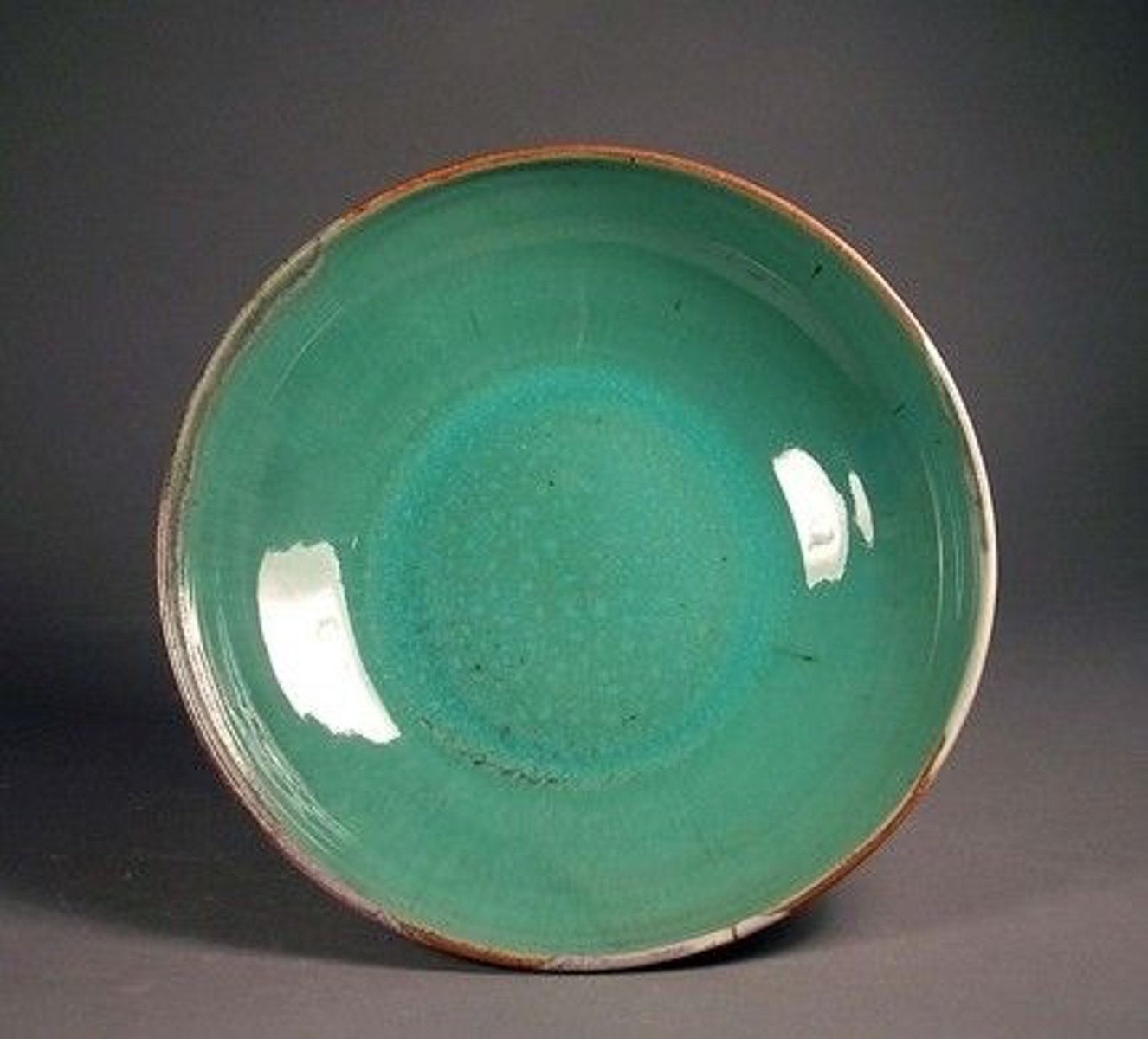 <p>clay, melter, binder, colorant, glass former (silica) - glossy finish (has glass)</p>