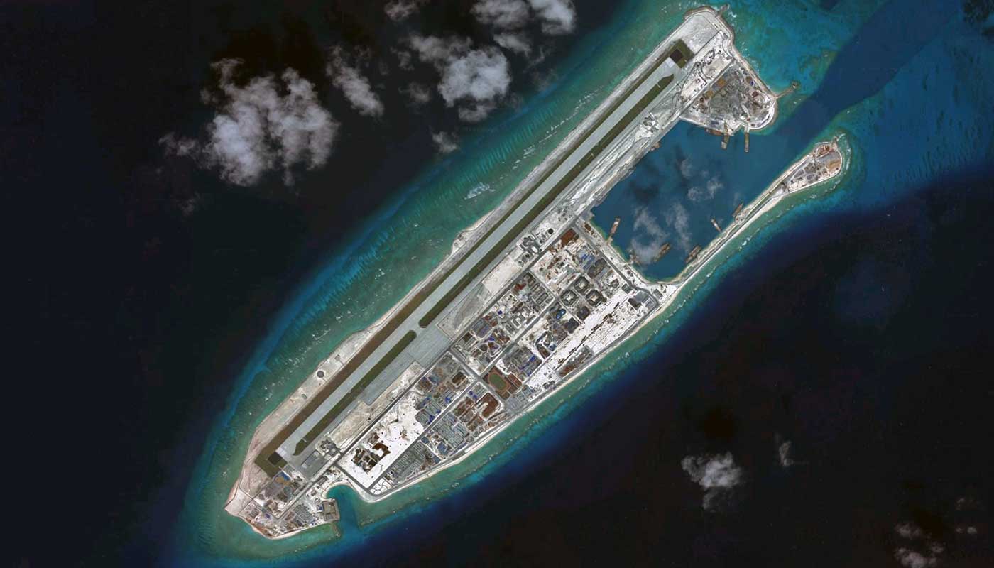 <p>China expressed anger at US naval ship sailing by artificial reefs Beijing is building among disputed islands in South China Sea</p>