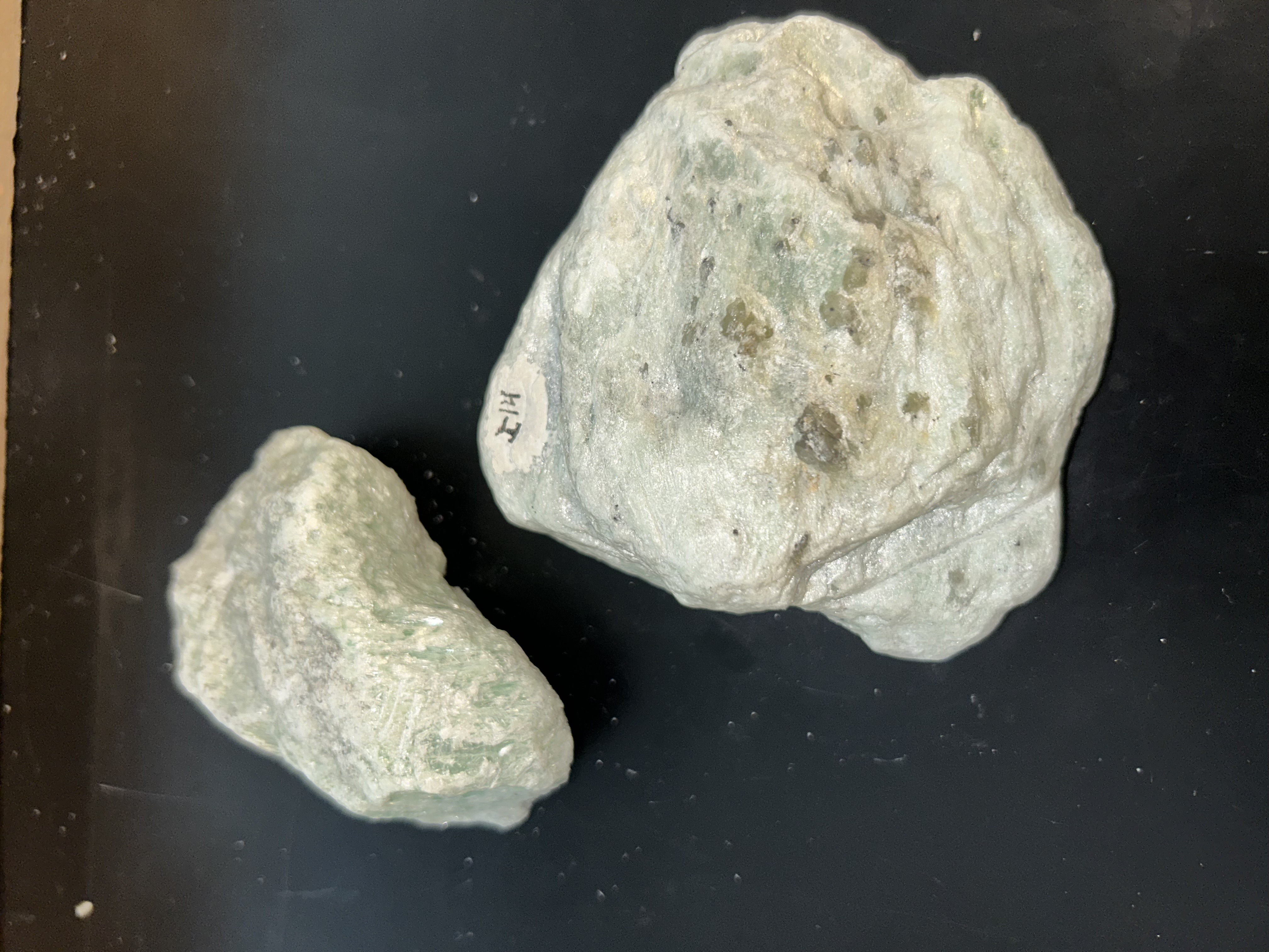 <p>soapy/slippery </p><p>light green/white </p>