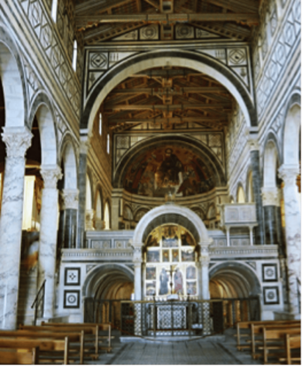 <p>What Romanesque church has a wooden roof, but its interior is elaborately decorated with black and white marble in a geometric pattern?</p>