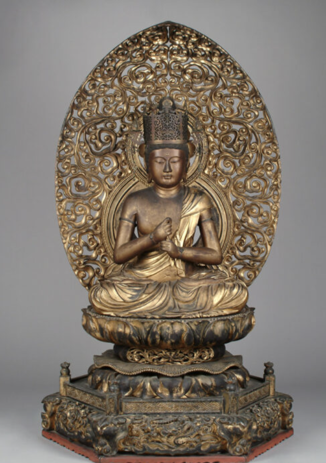 <p>The celestial Buddha representing the concept of enlightenment and the principle of cosmic truth; Vairocana is often depicted at the center of the mandala and symbolizes the illumination that dispels ignorance; mudra shows Buddha holding right index finger with left fist</p>