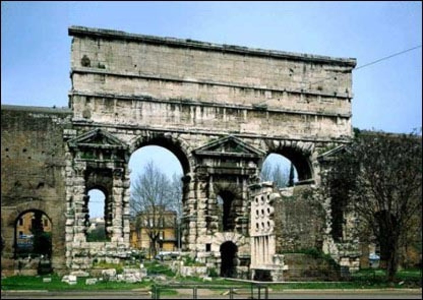 <p>-Claudian rusticated look</p><p>-Drawing attention to aqueduct</p><p>-Edge of city</p>