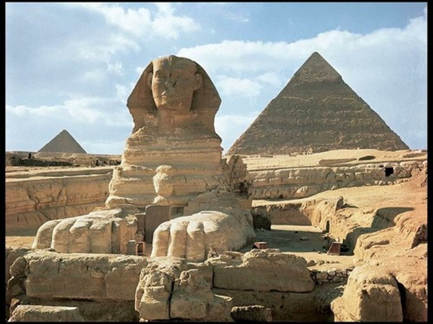 <p>Form:<br>-square base with 4 sloped sides (represents rays of sun)<br>-polished limestone<br>Content:<br>-pyramids with adjoining funerary complex; get to these through secret passageways<br>-Great Sphinx: human head with lion head<br>-descending order on West side of Nile<br>Function:<br>-maintain and protect tombs for eternity<br>-Great Sphinx: protecter the pyramids behind it<br>Context:<br>-built by Khufu, Khafre, and Menkuare (each temple name after)<br>-Khufu temple (oldest and largest)<br>-Old Kingdom- 2500BCE<br>-Giza, Egypt</p>