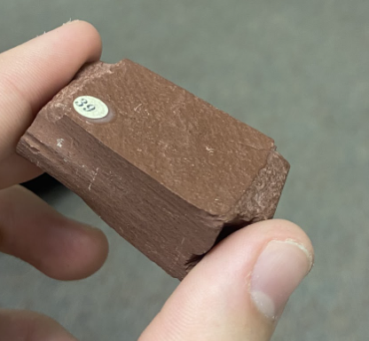 <p>Feels/looks like brick, <strong>Metamorphic</strong></p>