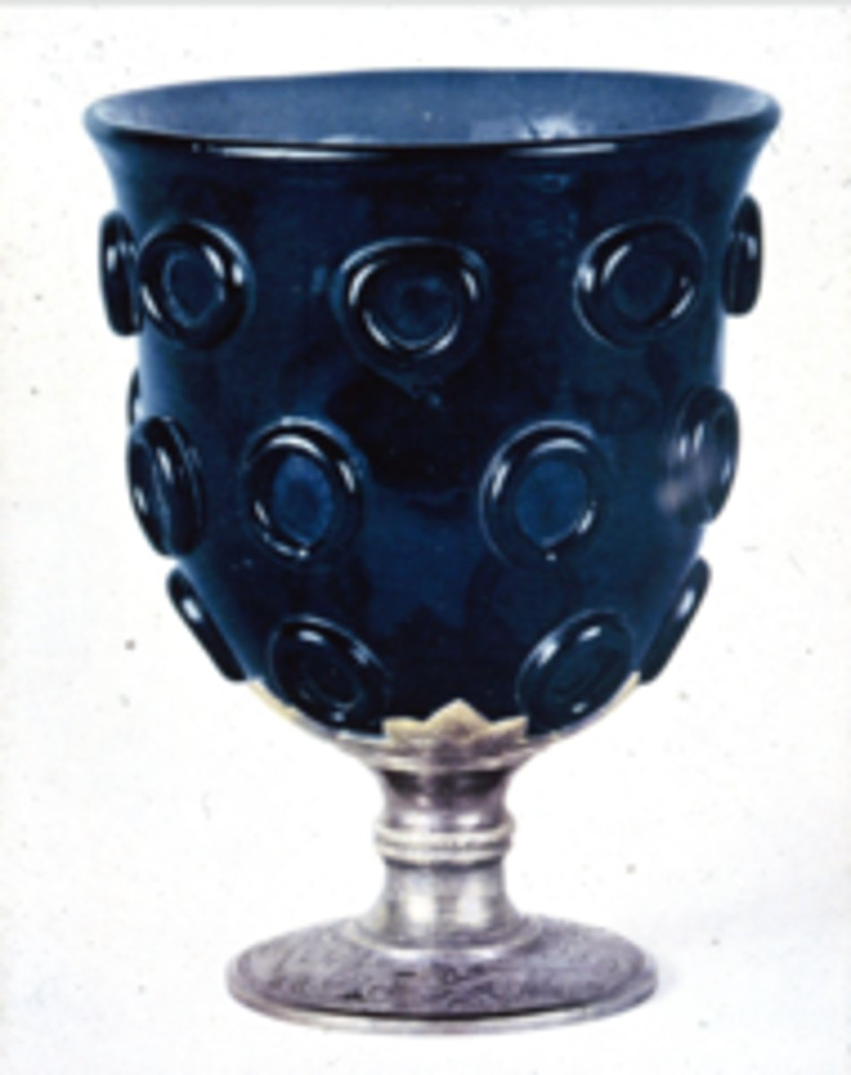 <p>what is the significance of the glass cup with silver base</p>