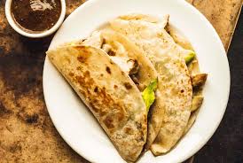 <p>3 Soft tortilla filled with breaded steak (milanesa de puerco), sour cream and sliced avocado, served with rice and beans</p>