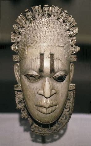 <p>A decorative pendant worn by the Queen Mother of Benin, symbolizing power and status, often featuring intricate designs and materials. </p>