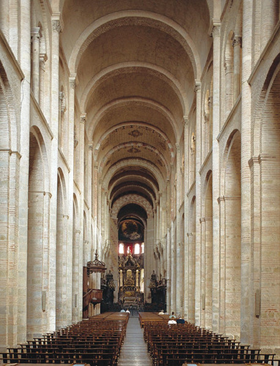 <p>-barrel vaults</p><p>-Transverse arch: an arch separating one vaulted bay from another</p><p>-2 aisles, 1 as an ambulatory: aisle that has no beginning or end</p><p>-very dark</p><p>-Romanesque Architecture</p>