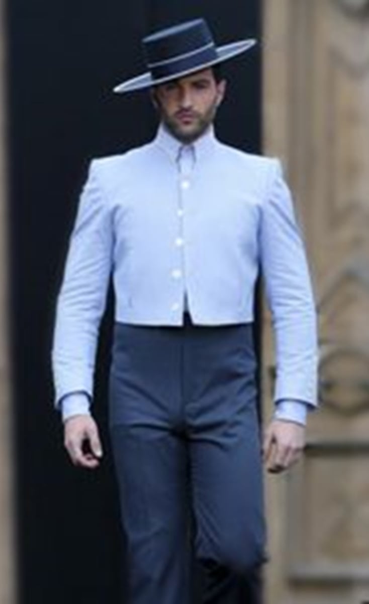 <p>Short jackets, pants, boots, and "cordobés" (hats) worn by the men at the</p><p>Seville fair.</p>