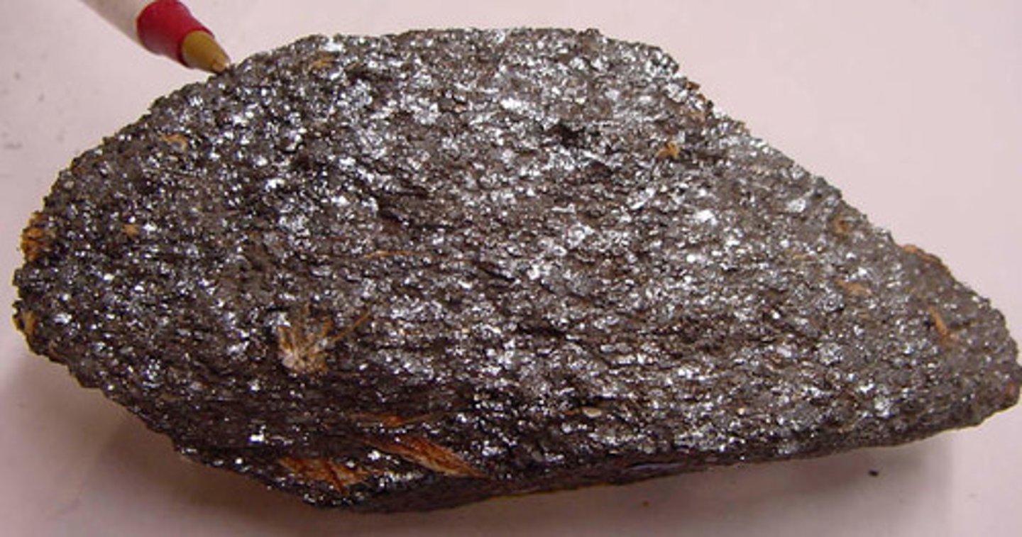 <p>Metallic Luster. 6.5-5.0 hardness. Red-Brown streak. 5.3 specific gravity. Silver-grey color, may have tiny glittery flakes, may tarnish red.</p>