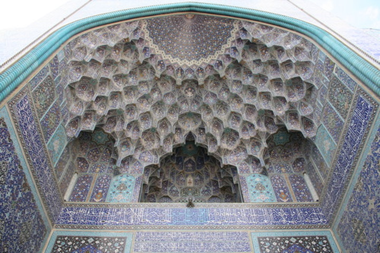 <p>A decorative architectural feature used in Islamic buildings, often appearing as a series of small, vaulted niches that form a honeycomb-like pattern.</p>