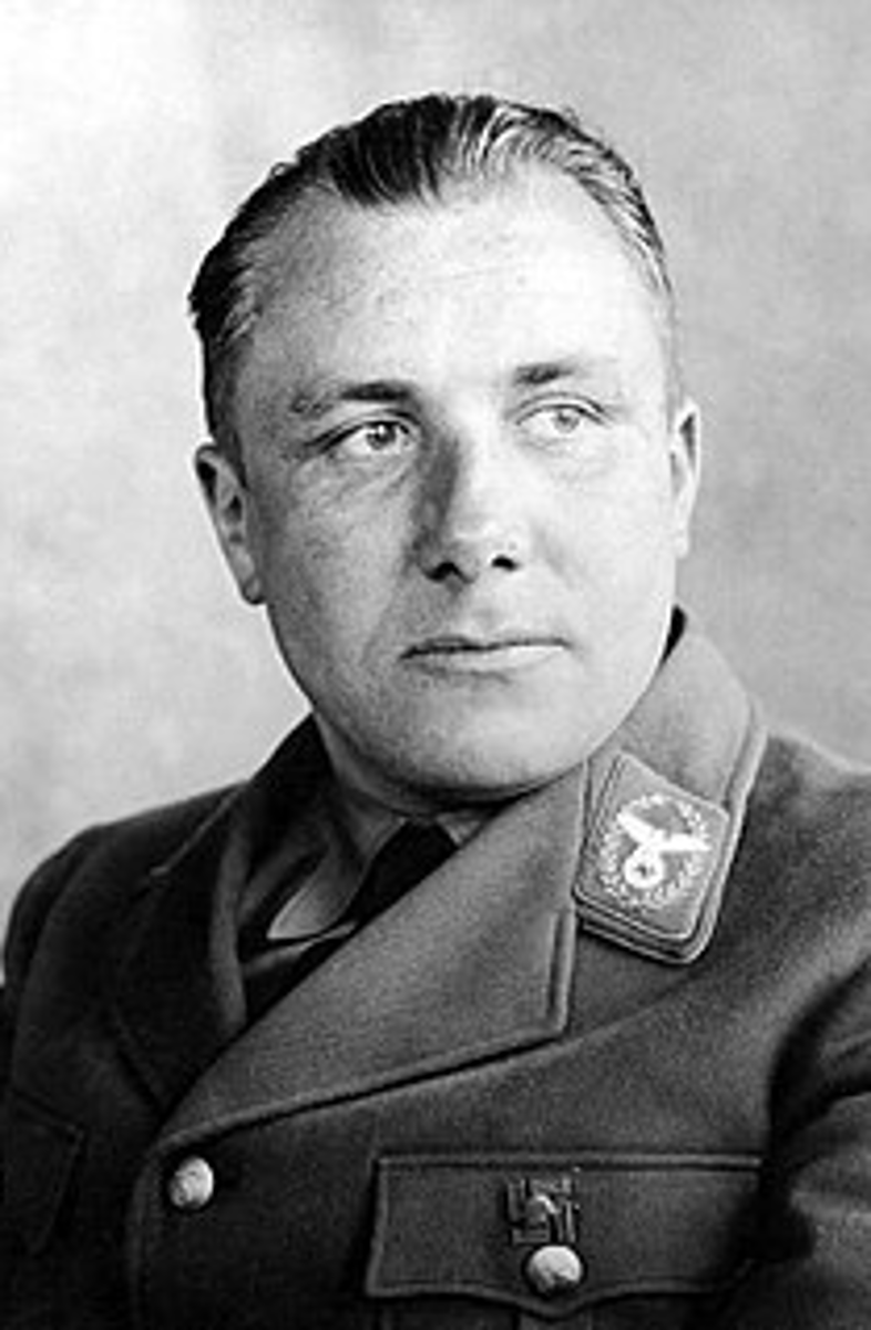 <p>Leading figure of the Nazi party</p><p>Head of the Nazi party Chancellery, Secretary to the Fuhrer</p><p>- Least visible but the most powerful of the Nazis by 1942</p><p>- Controlled appointments, promotions, who Hitler met with</p><p>- Recipient of Hitler's total trust</p><p>- Master or political intrigue and in-fighting</p><p>- Known as the 'Brown eminence'</p><p>- Virtually second in the party to Hitler</p><p>- Committed suicide in 1945, posthumously tried in the Nuremberg trials &amp; found guilty of war crimes</p>