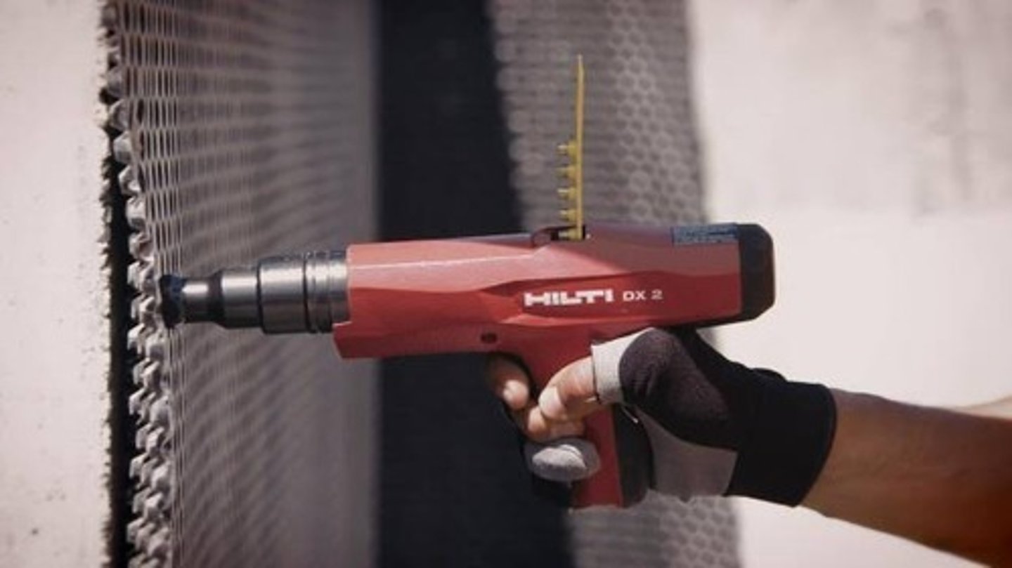 <p>is a kind of nailer that is powered by gunpowder and is used to drive long pins into wood, steel or concrete.</p>