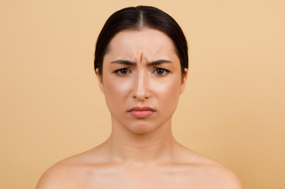 <ul><li><p>Muscle: <span style="color: rgb(244, 250, 167);"><strong><u>depressor anguli oris</u></strong></span></p></li></ul><ul><li><p><strong>Depressor Anguli Oris (DAO):</strong> This muscle originates on the mandible (chin bone) and attaches to the <span style="color: rgb(244, 250, 167);"><strong>corner of the mouth (oral angle)</strong>. Its name means "depressor of the angle of the mouth."</span></p></li><li><p><strong>Action:</strong> When it contracts, it <span style="color: rgb(244, 250, 167);">pulls the corner of the mouth <strong>straight downward</strong></span>, creating the downturned corners characteristic of a<span style="color: rgb(244, 250, 167);"><strong> frown or sad expression.</strong></span></p></li></ul><p></p>