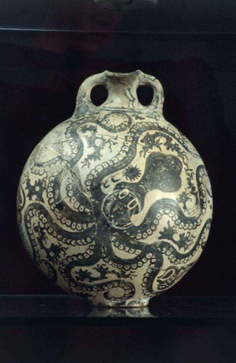 <p>Who:</p><p>The artist is unknown, but it's attributed to the Minoan civilization12.</p><p>What:</p><p>This is a Marine Style flask1. It is decorated with large octopuses which are depicted frontally but appear to be swimming diagonally, their writhing tentacles covering the whole surface of the flask1. Among the tentacles are themes denoting the seabed, such as sea urchins, tritons and small rocks with seaweed1.</p><p>Where:</p><p>The flask is currently housed in the Archaeological Museum of Heraklion12.</p><p>Original Findspot:</p><p>The flask was found in Palaikastro, a wealthy site on the far eastern coast of Crete23.</p><p>When:</p><p>The flask dates to around 1500-1450 BC12.</p><p>Why it's interesting and important:</p><p>The flask from Palaikastro is one of the most iconic vases of the Marine Style and a masterpiece of the Minoan potter's art during the New Palace period1. The exceptional naturalistic conception is typical of the vase painter, named the "Marine Style Master"2. The Marine Style is one of the styles that make up the "Special Palatial Tradition", the ceramic production of the New Palaces1. In the case of the Marine Style, the decorative motifs are not just aesthetically pleasing but also carry symbolic meaning1.</p><p>The Marine Style decoration on the Minoan jar from Palaikastro carries symbolic meaning. The marine world is emphatically presented as a reference point in both the daily life and religious beliefs of the Minoans1. The octopuses and other sea creatures depicted on the jar are not just aesthetically pleasing but also carry symbolic meaning1. The style is reminiscent of the monumental fresco paintings and gives a clear sense of "horror vacui" or "fear of empty space", meaning that the whole surface is filled with details1. While there is not a specific narrative, it is clear that the overall meaning is a representation of a love for the sea2. This subject matter on vases is called of "Marine Style" pottery2. The marine style is shown in the design of the subject as well as the overall structure of the jar2.</p>
