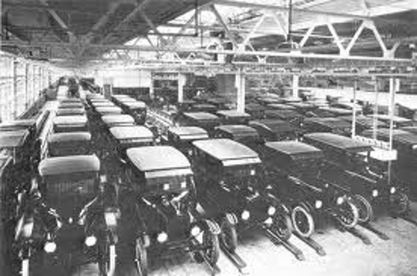 <p>Process of making large quantities of a product quickly and cheaply</p><p>production of goods in large numbers through the use of machinery and assembly lines</p>