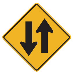 The one-way street or roadway is about to change to two-way traffic; there will be oncoming traffic. 