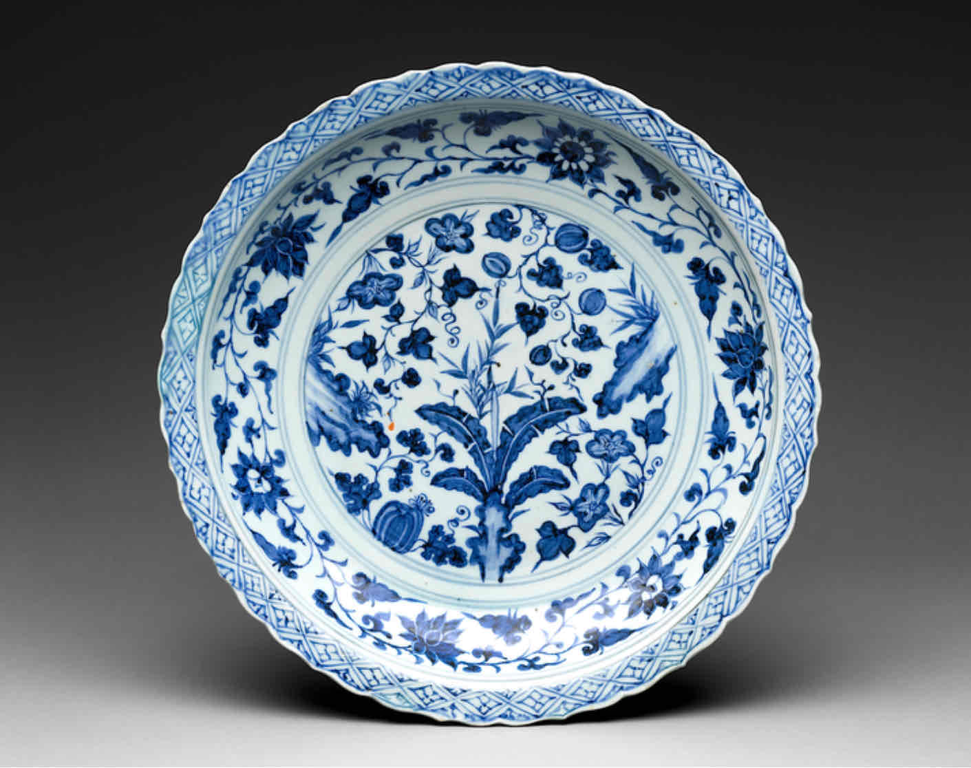 <p>Reflects the evolving aesthetics of Chinese porcelain influenced by foreign trade, particularly with Persia, during the Song dynasty. This piece showcases the integration of Islamic-inspired blue and white underglaze designs, highlighting the cultural exchange and interaction between China and Persia. It symbolizes the dynamic nature of identity and artistic expression, emphasizing the fluidity of cultural influences over time.</p>