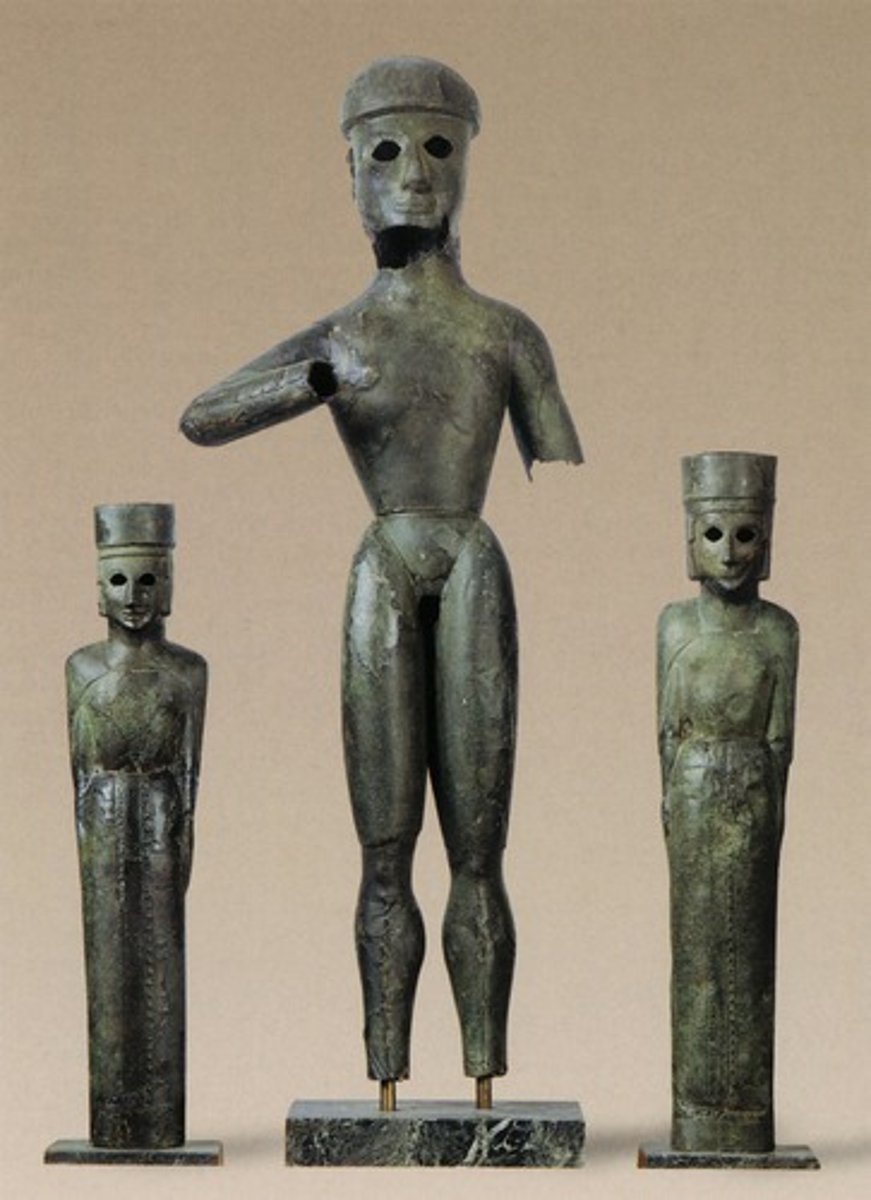 <p>Who: The statues are identified as the god Apollo, the goddess Artemis, and their mother Leto1.</p><p>The Cult Statues from Dreros, Temple of Apollo, were made by ancient Greek artisans around 700 BC</p><p>What: These are a group of three bronze statuettes, with a larger male figure between two female ones1. They are the earliest known hammered statuettes, made of joined bronze sheets over a wooden core which has not been preserved1.</p><p>Where: The statues were found inside the temple of the agora of the ancient city of Dreros1. They are currently housed in the Heraklion Archaeological Museum1.</p><p>When: The statues date back to the 8th century BC1.</p><p>Why it's interesting and important: These statues are especially important from a technical point of view, as they are the earliest in Greece made by hammering2. They all had a wooden core, onto which the metal plaques were nailed, and inlaid eyes of a different material2. The central figure, a man wearing a loin-cloth, is identified as Apollo the archer2. The figures are rounder and bulkier than earlier bronze statuettes of the early 8th century BC. They show the development of the human form, in Archaic art, in which anatomical details are rendered naturalistically1.</p><p>The statues are early examples of hammered statuettes, made of bronze sheets over a wooden core1. This technique was a significant development in Greek art and sculpture1.</p>