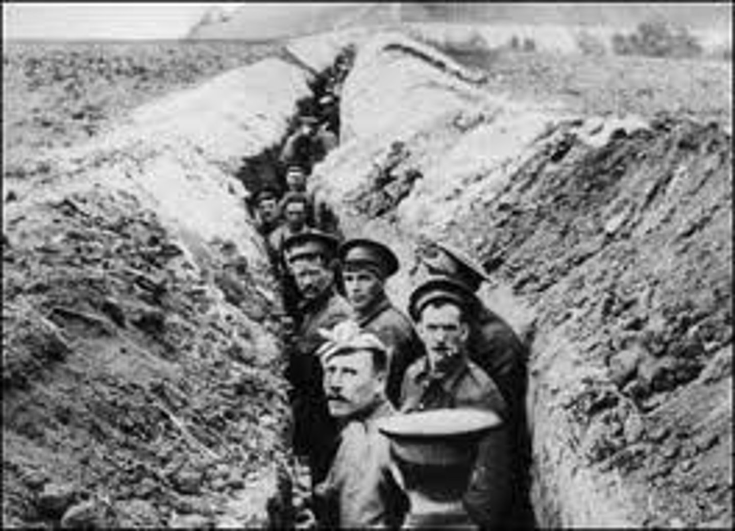 <p>Fighting with trenches, mines, and barbed wire. Horrible living conditions, great slaughter, no gains, stalemate, used in WWI.</p>