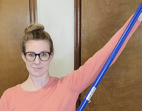 <p>Moving your arm out to the side and upwards, like waving hello or goodbye.</p>