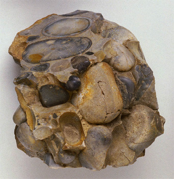 physically deposited particles derived from weathered rocks
