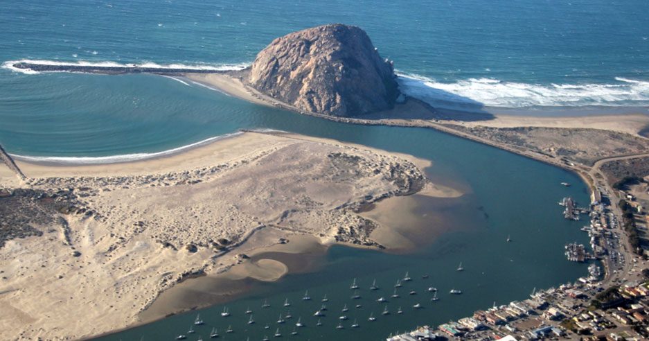 <p>Erosion occurring in a<span>n estuary, inlet, or bay protected from the full force of open ocean waves by headlands or other landforms</span></p>