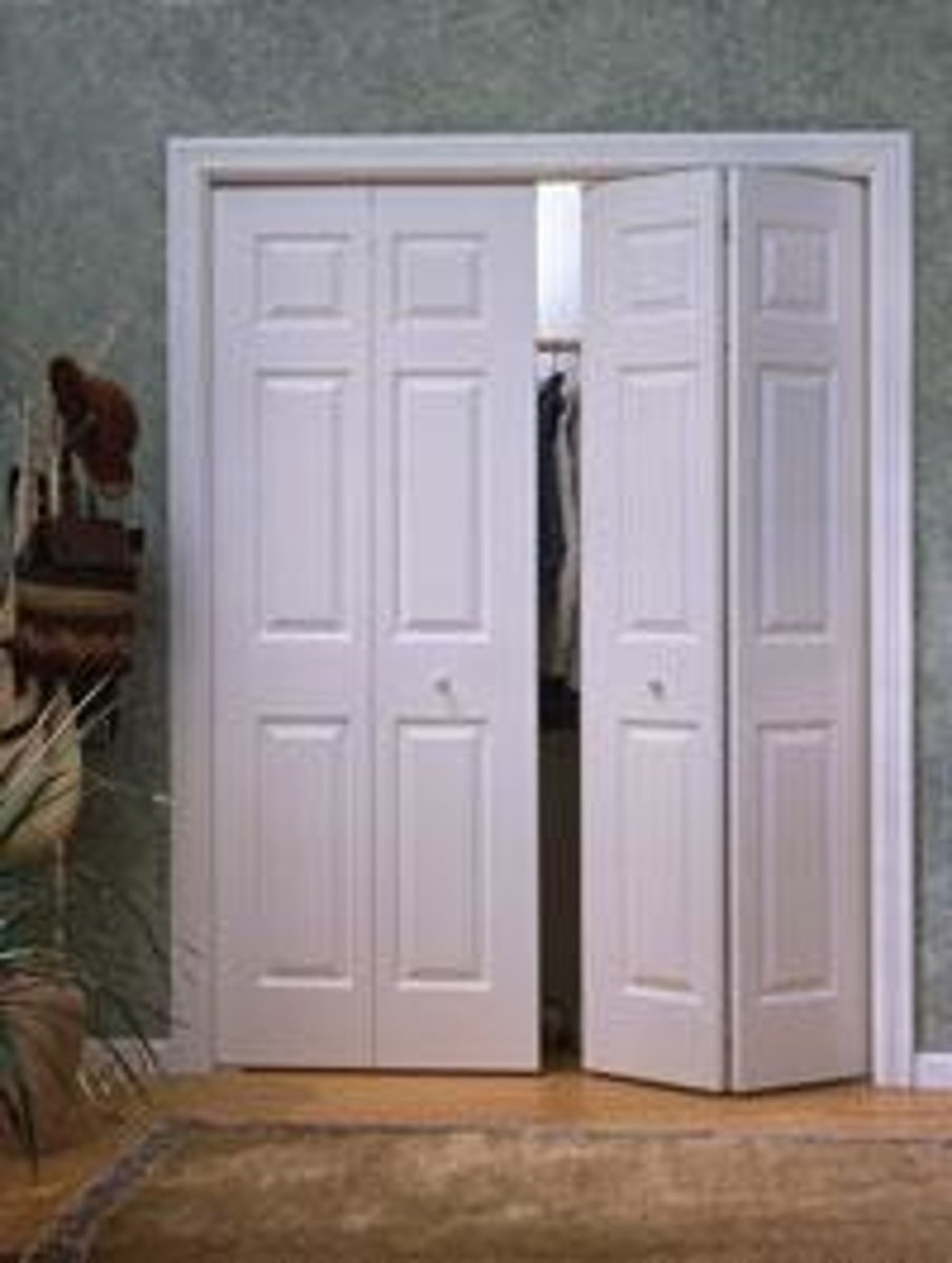 <p>A folding door that divides into two leaves, the inner edge of each leaf being hung from an overhead track and the outer edges pivoted at the jamb</p>