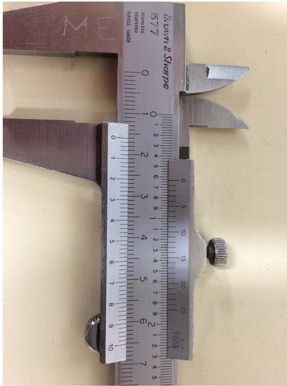 What's the measurement on the caliper below (in inches)?