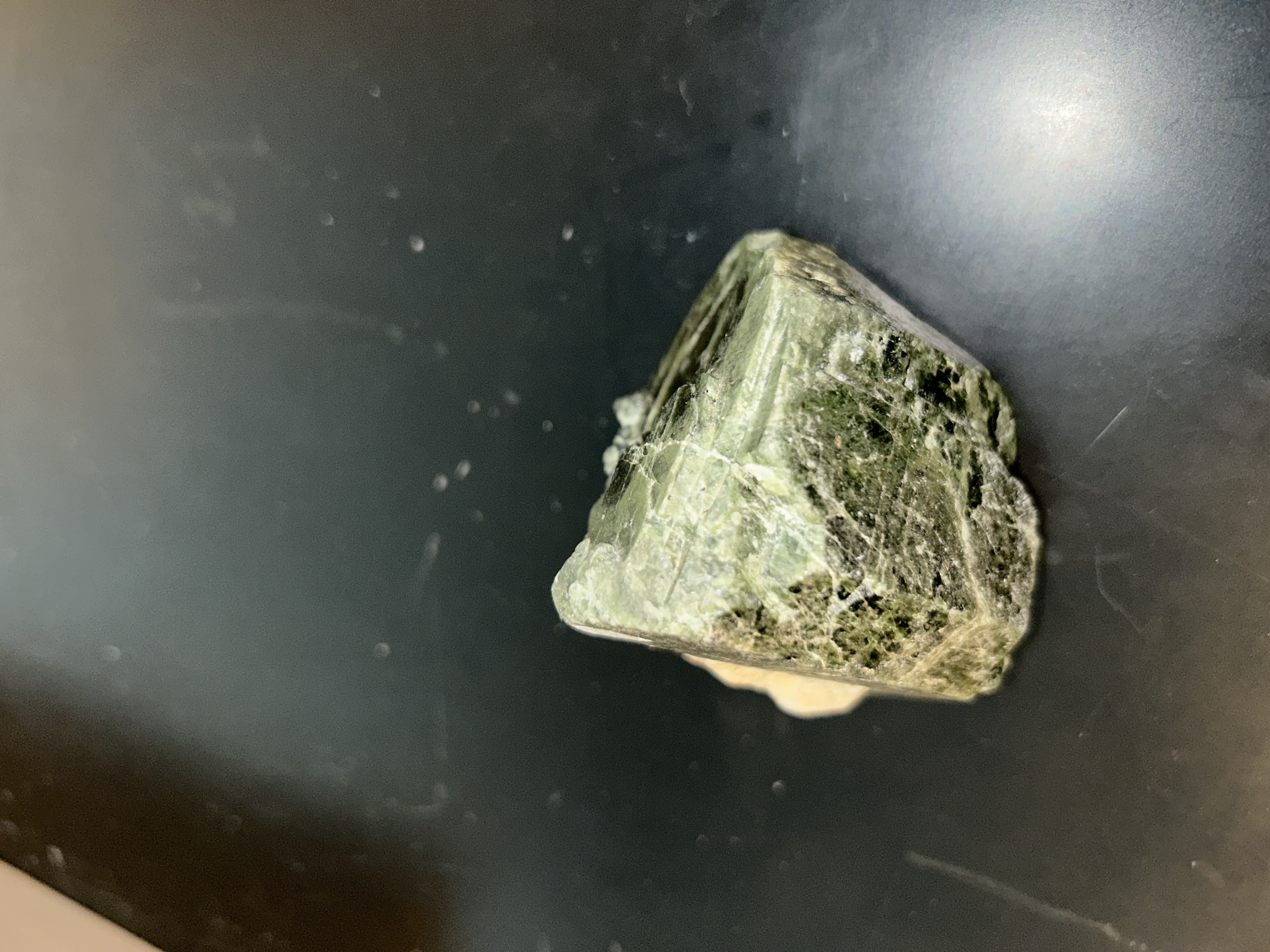 <p>Augite:</p><ul><li><p>﻿﻿pyroxene cleavage: two planes intersect at 87° and 93° angles</p></li><li><p>﻿﻿vitreous luster</p></li><li><p>﻿﻿color: dark green to black (darker than diopside)</p></li><li><p>﻿﻿forms prismatic or blocky, equant crystals</p></li><li><p>﻿﻿hardness: 5-6; specific gravity: ~3.3</p></li></ul><p>Diopside</p><ul><li><p>﻿﻿pyroxene: 2 cleavages intersect at 87° and 93° angles</p></li><li><p>﻿﻿forms prismatic or blocky and equant crystals. also granular massive, columnar, and lamellar.</p></li><li><p>﻿﻿sometimes twinned</p></li><li><p>﻿﻿ to pale green (paler than Augite)</p></li><li><p>﻿﻿hardness: 5-6, specific Gravity: ~3.3, luster:<br>vitreous</p></li></ul>