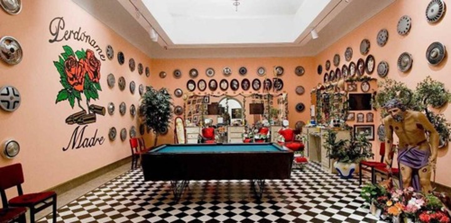 <p>Pepon Osorio</p><p>1994 CE</p><p>Form: Mixed-media installation</p><p>Function: Based on Osorio's own experience as a child receiving his haircut and hearing that he could not cry.</p><p>Osorio created an interactive experience. The installation was set up in a vacant store turned into a kitschy barbershop. Viewers walk into the store and are surrounded by images and videos showing the contradictions Latin men face in life. There are images, both still and video, of masculinity interspersed among those of men crying. The barbershop is filled with masculine items and remnants of a consumer-based society.</p>