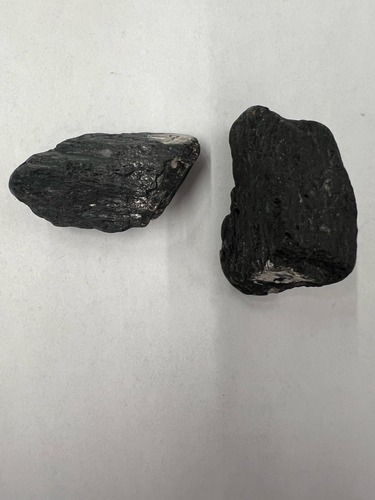 <ul><li><p>Black </p></li><li><p>metallic</p></li><li><p>2 planes of cleavage at 124 and 54 degrees </p></li><li><p>Hardness: 5-6</p></li></ul>