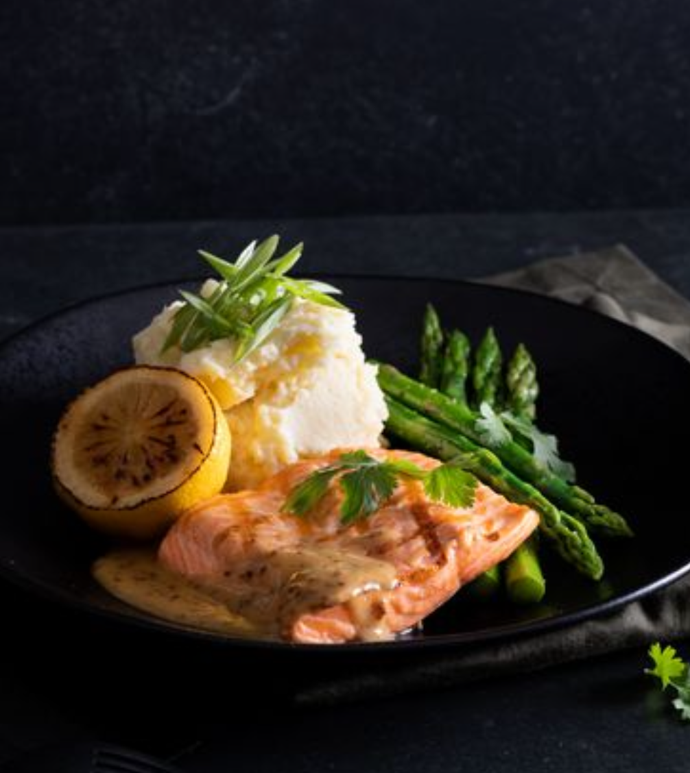 <p><span> &nbsp;OceanWise steelhead salmon, &nbsp;Green onion, Creamy buttered mashed potatoes, Charred lemon, Seasonal Vegetables, Cilantro, Soy-dijon butter sauce</span></p><p></p>
