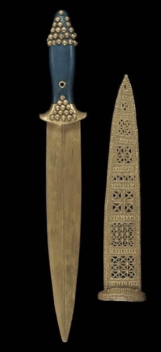 <p>Gold and lapis ceremonial weapons from Ur (ca. 2550-2400 BCE), signifying elite status.</p>