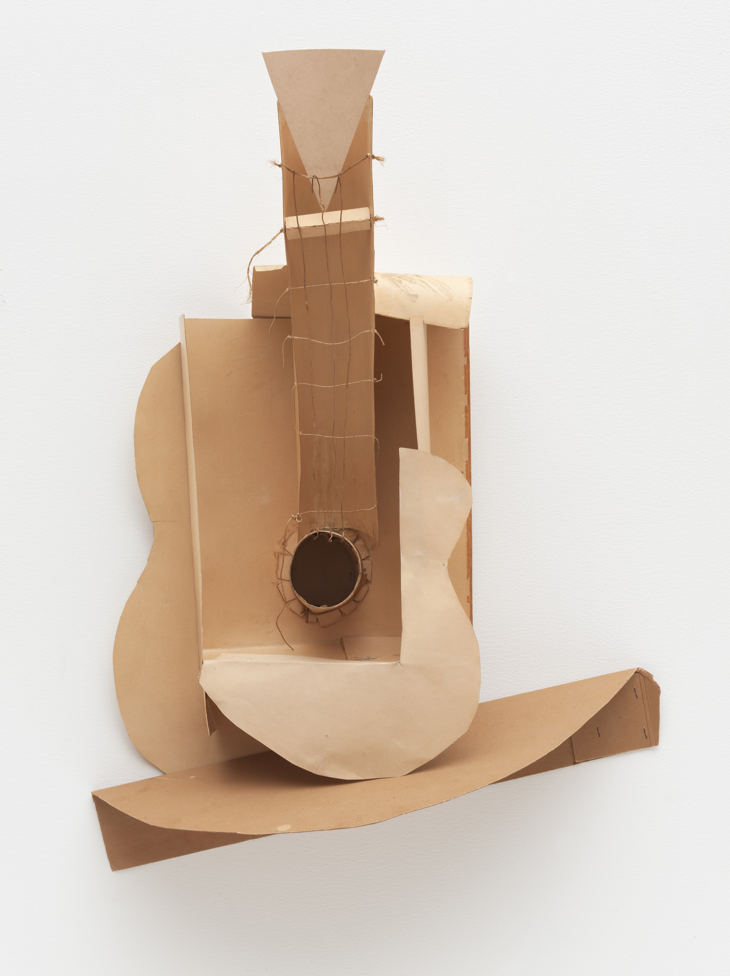 <p>Guitar, 1912,<span style="color: #ffffff"><em> </em></span><span style="color: #ffffff"><em>Paperboard, paper, thread, string, twine, and coated wire</em></span></p>