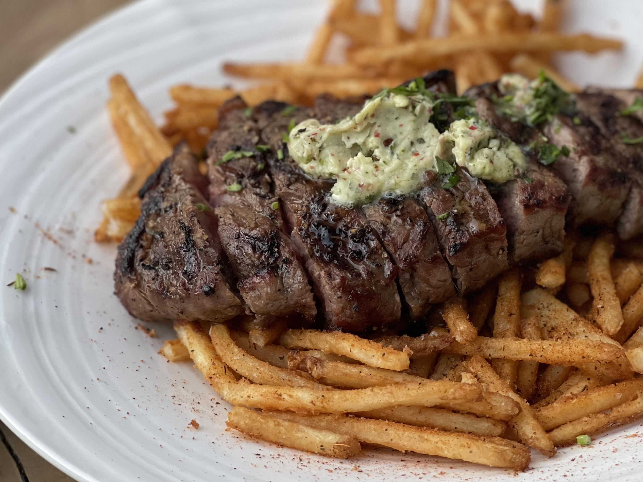<p>A classic dish of seared or grilled steak served with crispy French fries<span style="color: rgb(71, 71, 71)">.</span></p>