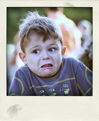 contort the face to indicate a certain mental or emotional state